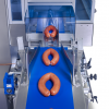 SleekWrapper inverted flow wrapper wrapping meat sausages