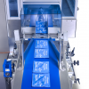 SleekWrapper automated flow wrapping machine wrapping medical devices
