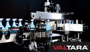 spray bottles being labeled by machine
